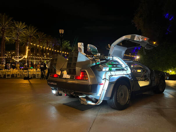 Evening outdoor dinner event with the Delorean Time Machine